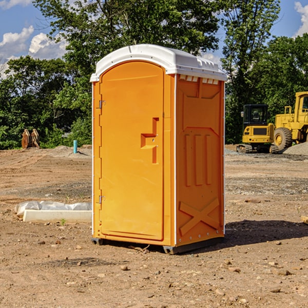 what is the cost difference between standard and deluxe portable toilet rentals in Grannis